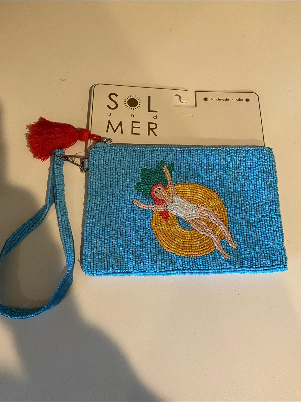 SOL and MER Blue Beaded Wristlet Clutch with Float Motif